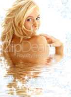 happy blond in water with snowflakes