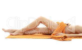 long legs of relaxed lady with orange towel #4