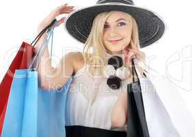 portrait of blond in hat with shopping bags