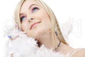 happy blond angel girl with feather boa