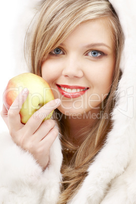 lovely blond in fur with apple