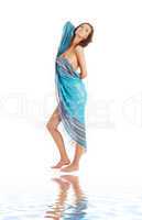 girl with blue sarong on white sand