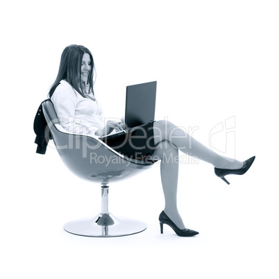 monochrome businesswoman with laptop in orange chair