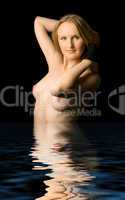 topless woman in dark water