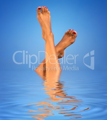 legs in blue water