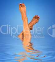 legs in blue water