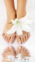 feet with madonna lily and water