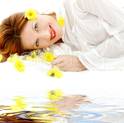 beauty with yellow flowers on white sand