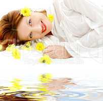beauty with yellow flowers on white sand