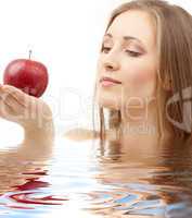 woman with red apple in water