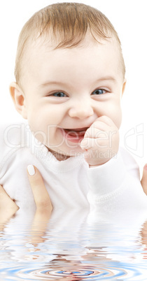 laughing baby in water