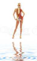 golden heels girl in bikini on white sand
