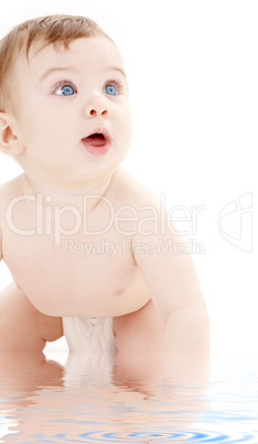 portrait of crawling baby boy looking up