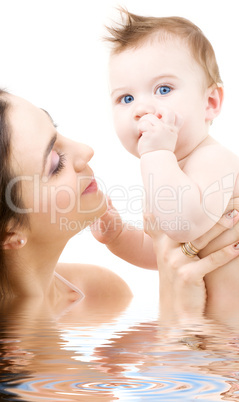 blue-eyed baby in mother hands
