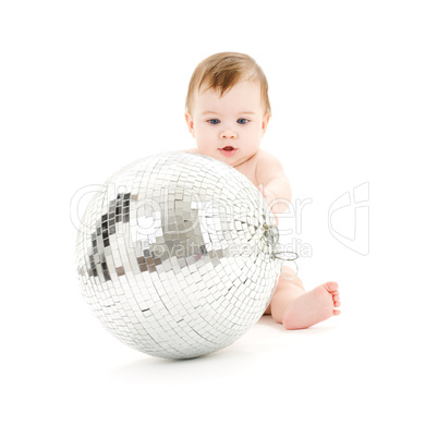 adorable baby boy with big disco ball