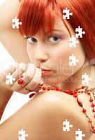 puzzle of redhead with red beads looking over shoulder