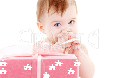 baby boy with puzzle gift box