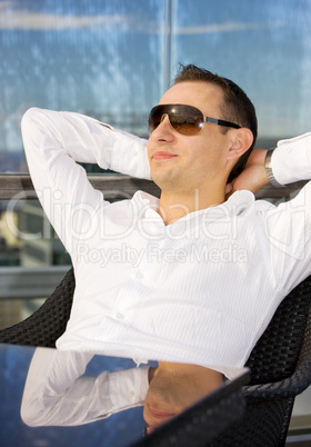 handsome man relaxing in chair