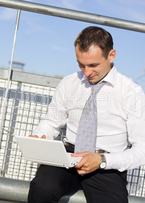 handsome businessman with laptop computer