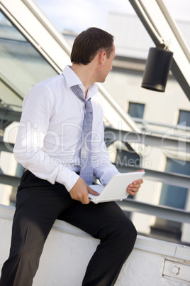 businessman with white laptop computer