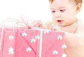 baby boy with puzzle gift box