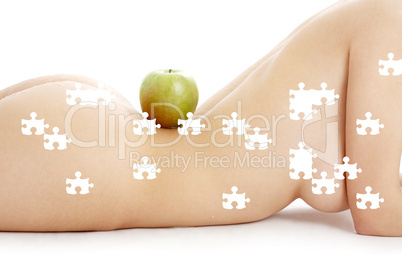 puzzle of woman torso with green apple