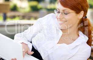 smiling businesswoman with laptop computer