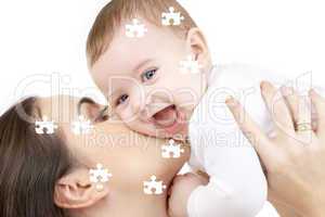 puzzle of laughing baby playing with mother