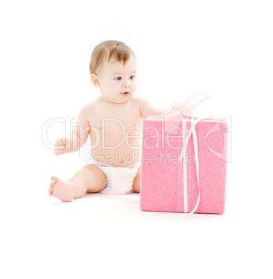 baby boy in diaper with big gift box