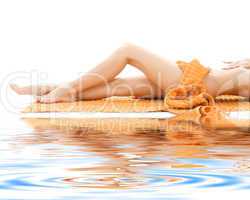 long legs of relaxed lady with orange towel