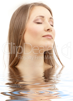 beautiful woman with closed eyes in water