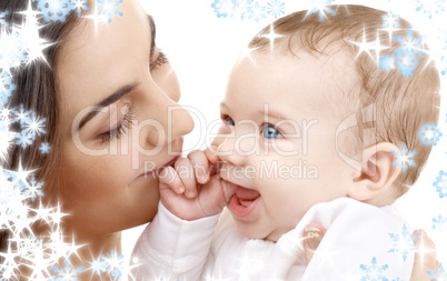 smiling baby in mother hands