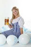 Blondine im Dirndl mit Maßkrug