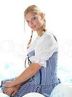 Blonde Frau mit Dirndl und Luftballons