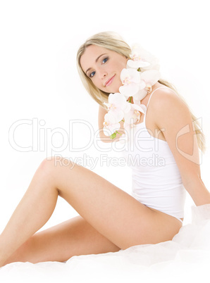 blonde in cotton underwear with orchid