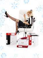 tired businesswoman in chair with snowflakes