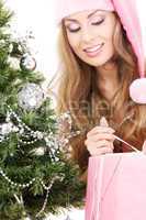 santa helper girl with gift box and christmas tree