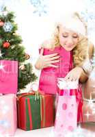 santa helper girl with gifts and christmas tree