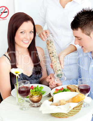 Loving young couple dining at the restaurant