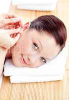 Close-up of a caucasian woman receiving a head massage