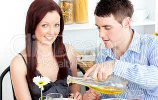 Young couple having dinner in the kitchen