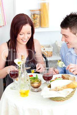 Caucasian couple having dinner in the kitchen