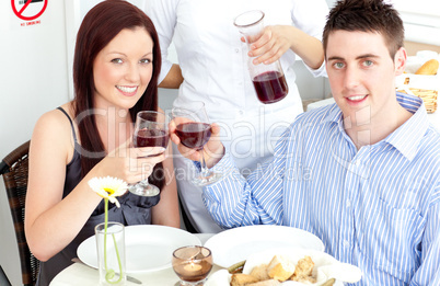 Lovely young couple dining at the restaurant