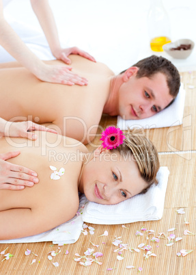 Attractive young couple enjoying a back massage