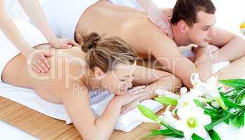 Enamored young couple enjoying a back massage