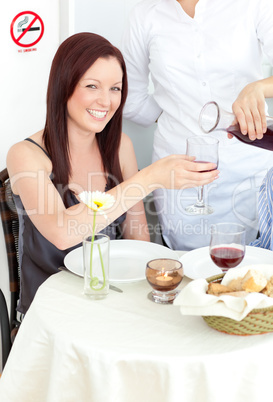 Pretty girlfriend at the restaurant with her boyfriend