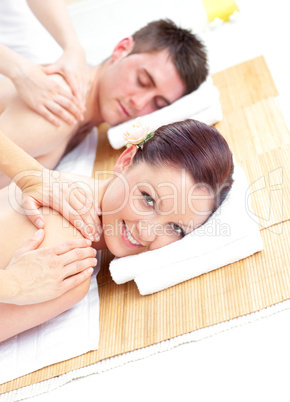 Attractive young couple receiving a back massage