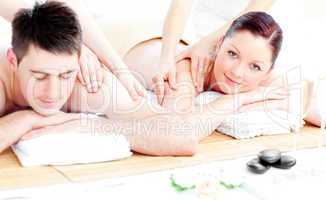 Loving young couple enjoying a back massage