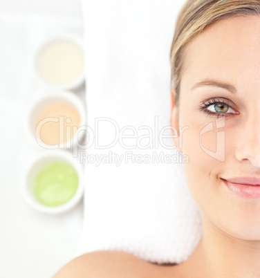 Portrait of an attractive young woman lying on a massage table