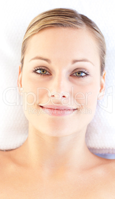 Portrait of a beautiful young woman lying on a massage table